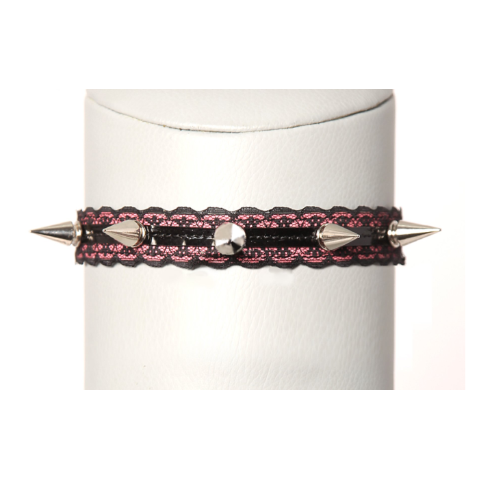 COLLAR DE PINCHOS ROSA Y NEGRO CON ANILLA CENTRAL.